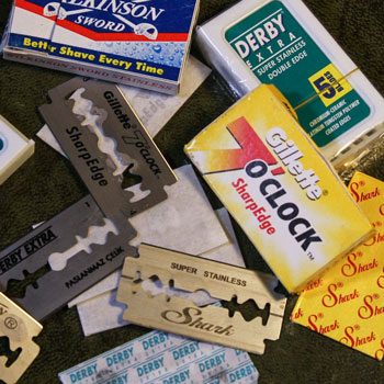 pile of derby shark wilkinson sword & gillette safety razor blades