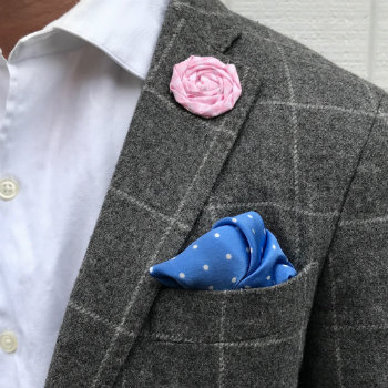 pink lapel flower with blue square