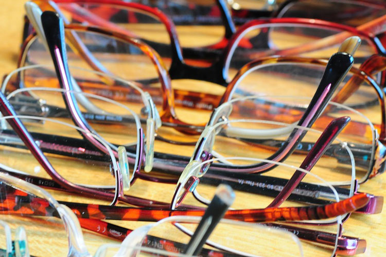 row of different eye glasses frames row of different eye glasses frames