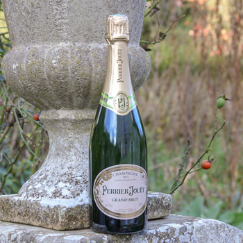 Perrier Jouet Grand Brut Champagne On Stone Wall