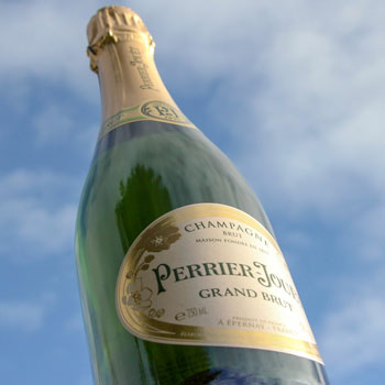 Perrier Jouet Grand Brut Champagne Sky Background
