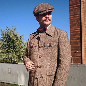 man-with-handlebar-moustache-flat-cap-bow-tie-&-norfolk-jacket