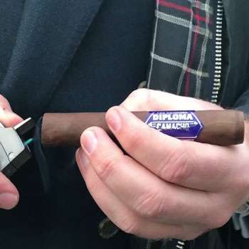 Camacho Diploma Cigar Being Lit