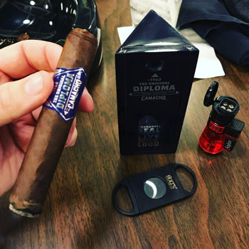Camacho Diploma Cigar Freshly Lit With Box