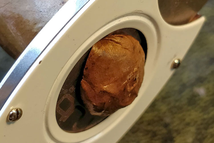 Cutting A Cigar In Action