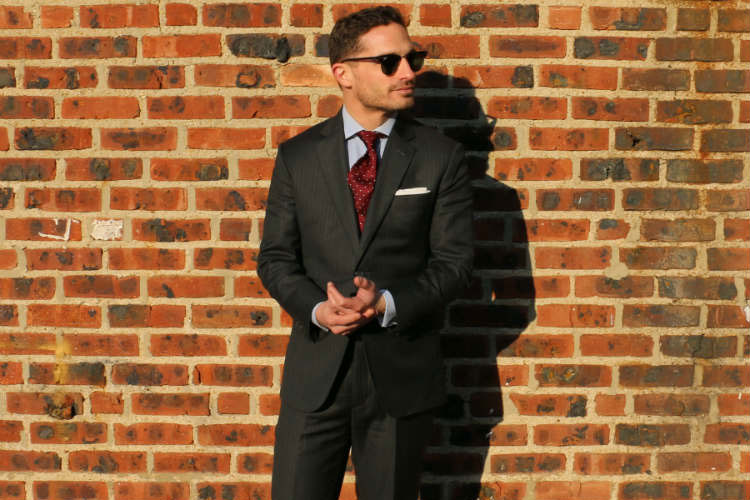 Man Wearing Power Suit & Sunglasses
