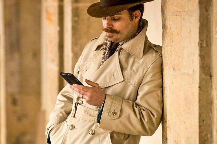 Man With Moustache In Vintage Fedora & Trench Coat