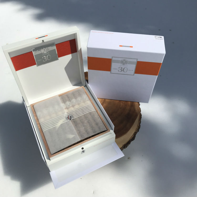 Open box of Avo 30th cigars in wrappers