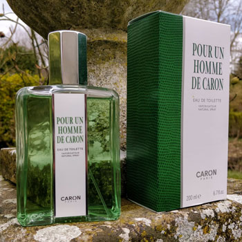 Pour Un Homme de Caron Cologne & Packaging On Stone Wall