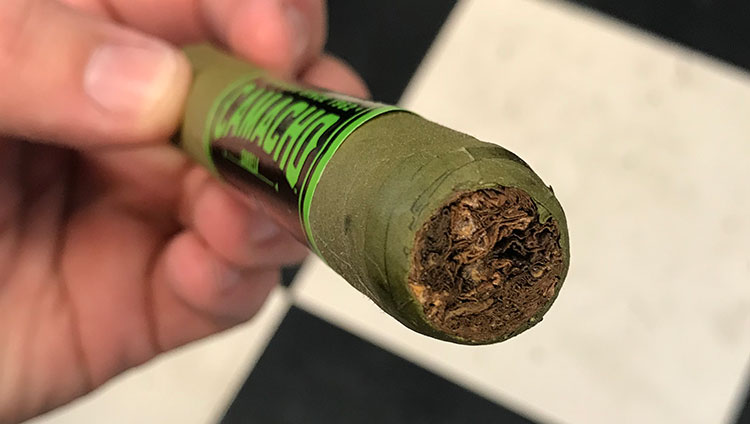 Removed-green-cap-of-cigar-showing-brown-filler