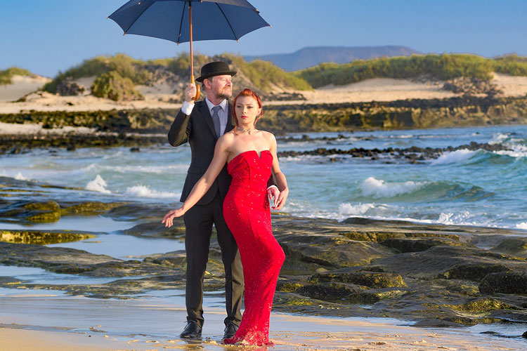 englishman in bowler hat on beach