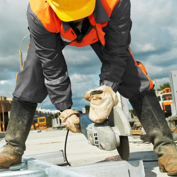Builder Cutting Breeze Block