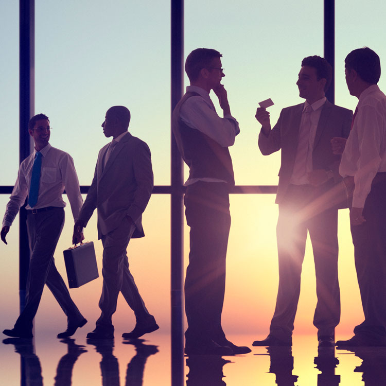 Business People Discussing In Front Of Sunset