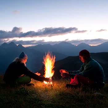 Couple Making Campfire At Night