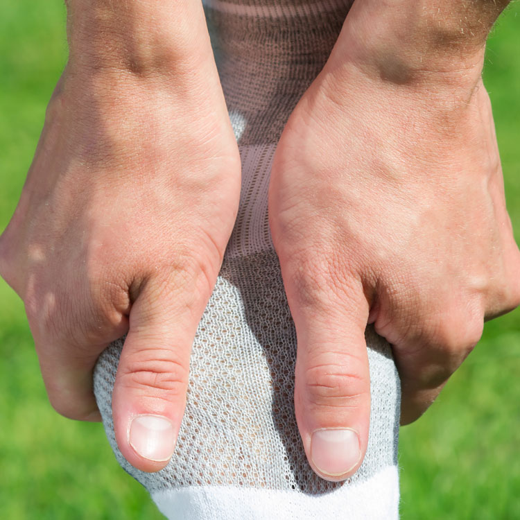 Man Rubbing Sore Foot