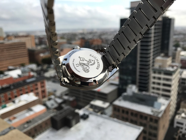 Omega Railmaster 1957 Watch Caseback Against Cityscape