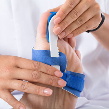 Orthopaedist Fixing Bunion Plaster