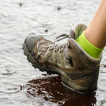 Walking Boots In Raining Puddles