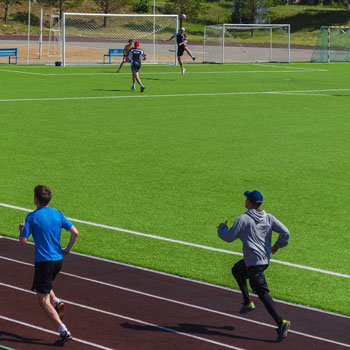 men running on track