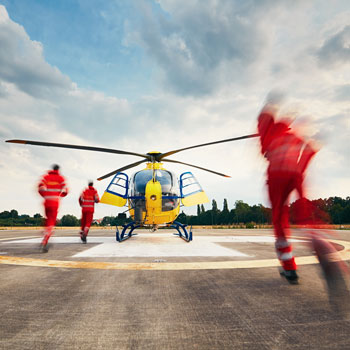 Air Rescue EMT Running To Helicopter