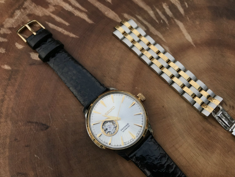 Black snake skin watch strap on Seiko watch