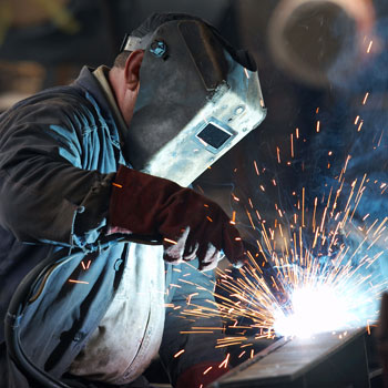 Industry Worker Welding Metal
