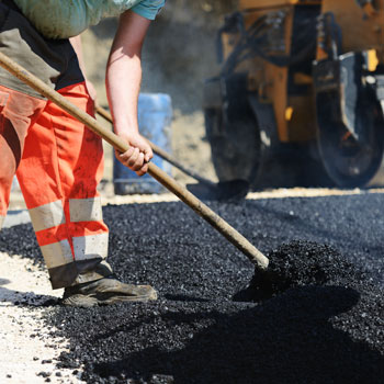 Road Workers On Asphalt