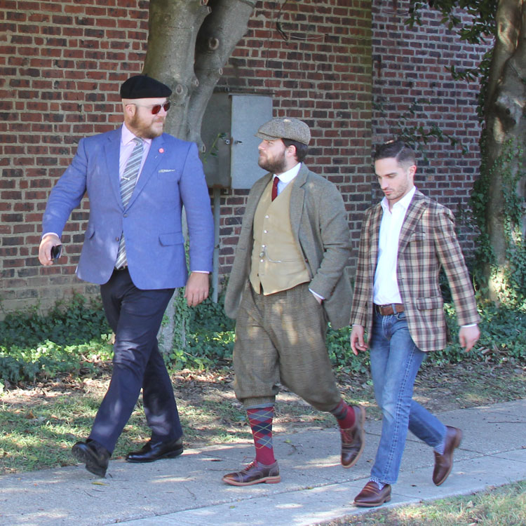 Stylish gentlemen men walking together
