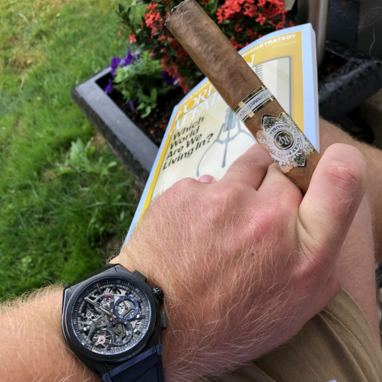 Watch with cigar and book