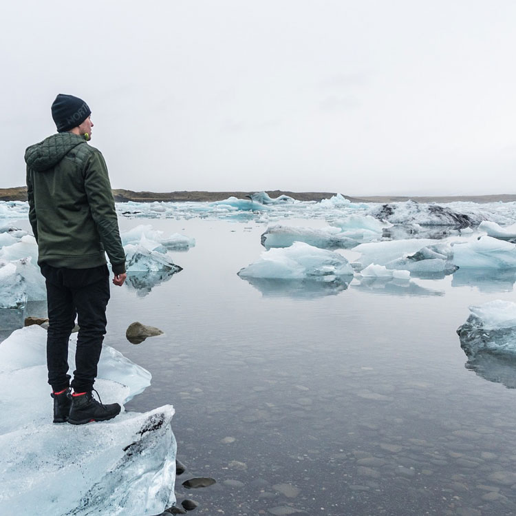Man Standing On Small Iceberg