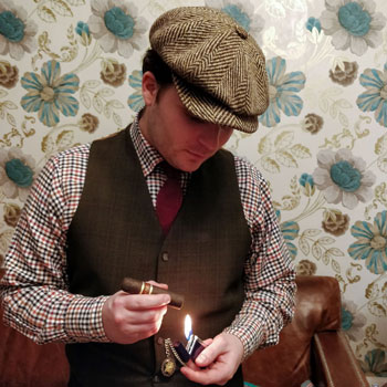 Nub Maduro Cigar Lit By Man In Tweed