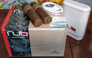 Nub Maduro Cigar On Box With Merchandise