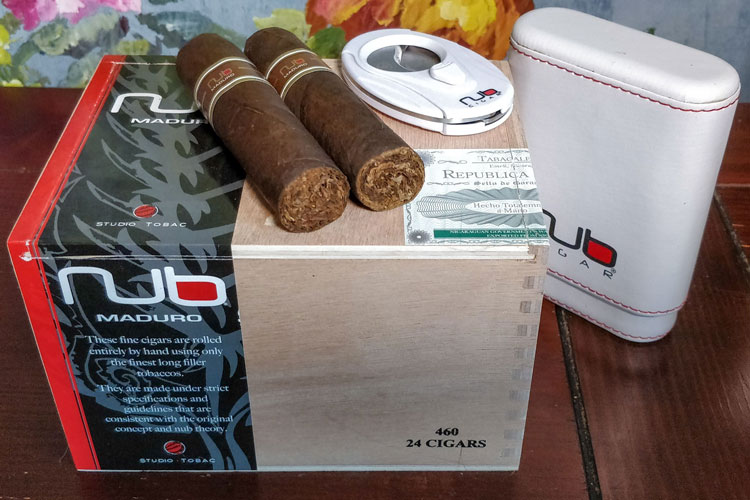 Nub Maduro Cigar On Box With Merchandise