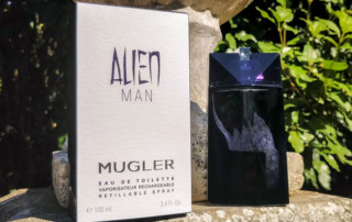 Mugler Alien Man Bottle Rear & Packaging On Stone Wall