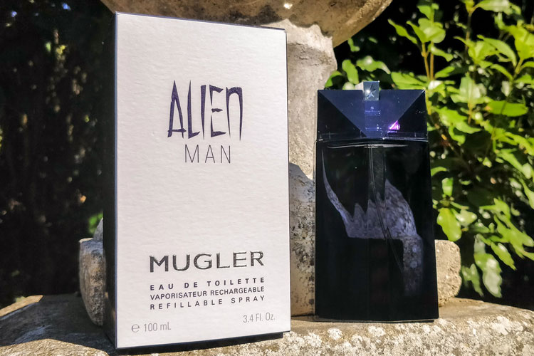 Mugler Alien Man Bottle Rear & Packaging On Stone Wall