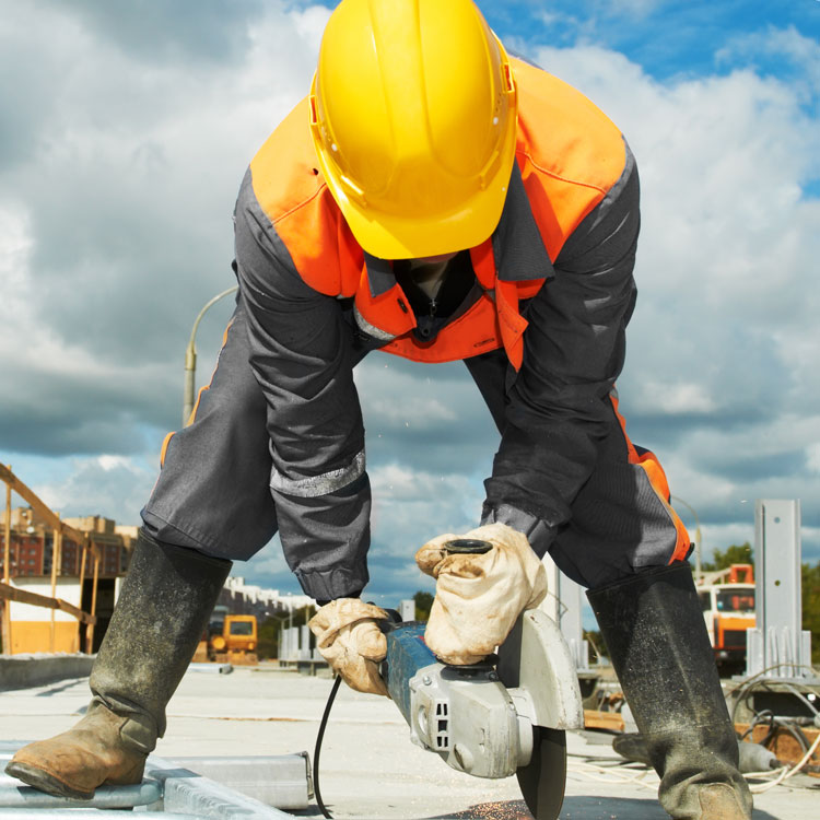 Builder Cutting Breeze Block