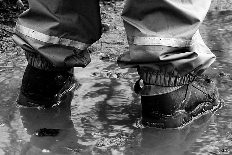 work boots in deep puddle