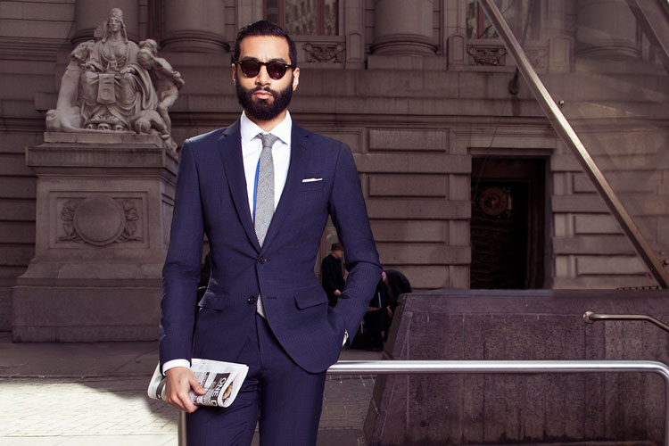 Man With Newspaper In Black Lapel Suit