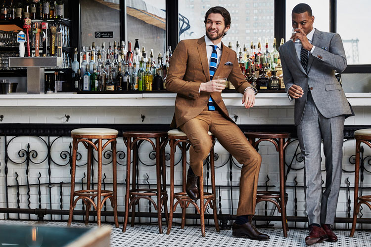 Men In Black Lapel Suits At A Bar