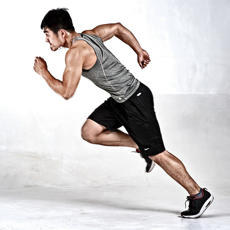 Man Sprinting Across Grey Background
