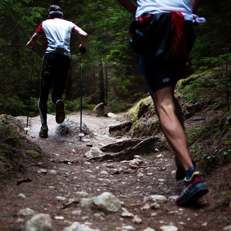 Men Trail Running Through Rocks