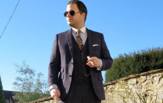 Man In Three Piece Indochino Suit Smoking Cigar