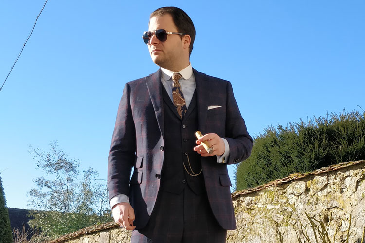 Man In Three Piece Indochino Suit Smoking Cigar