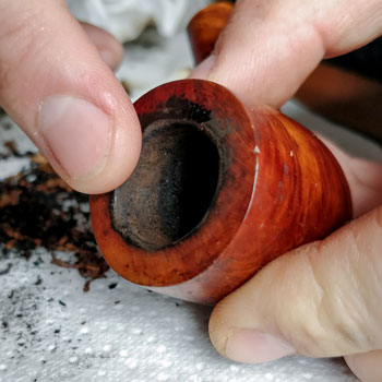 Cleaning A Pipe Rim With Saliva