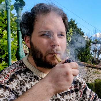 Man Smoking Tobacco Pipe