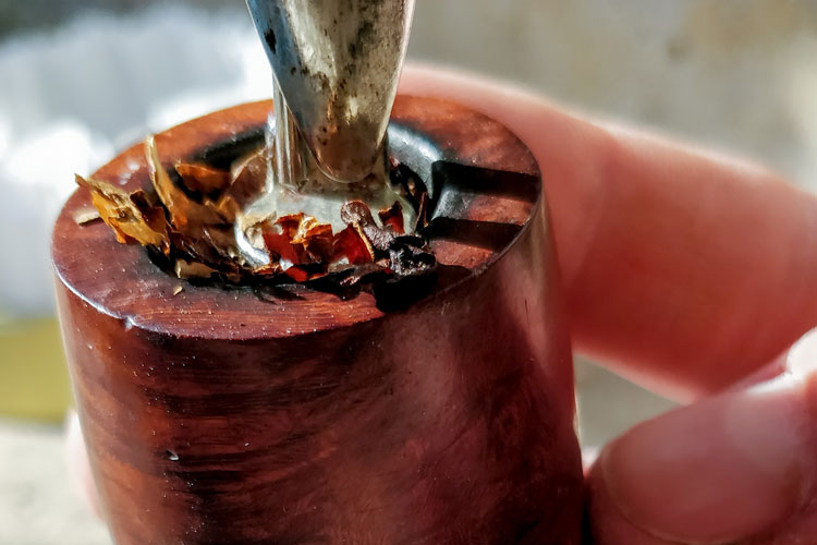 Tamping Final Fill Of Tobacco Pipe