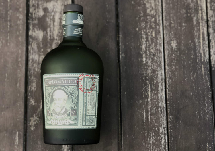 Reserva Exclusiva Bottle on Wood Table