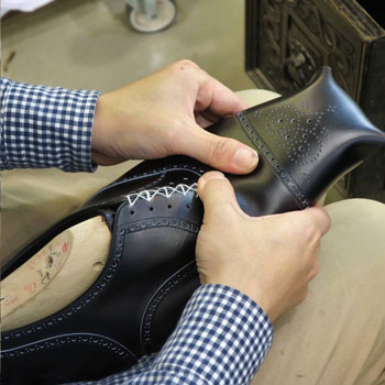 Marquess Shoemaker In Workshop