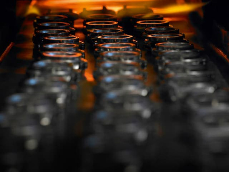 Breitling Cases On Belt Into Furnace