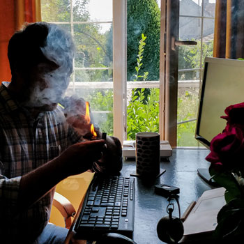 Charles-Philippe Lighting A Cigar In His Study